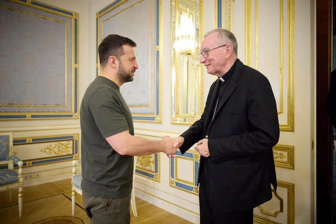 Ukraine's President Volodymyr Zelenskiy welcomes Vatican's Secretary of State Pietro Parolin before their meeting, amid Russia's attack on Ukraine, in Kyiv, Ukraine July 23, 2024. Ukrainian Presidential Press Service/Handout via REUTERS
