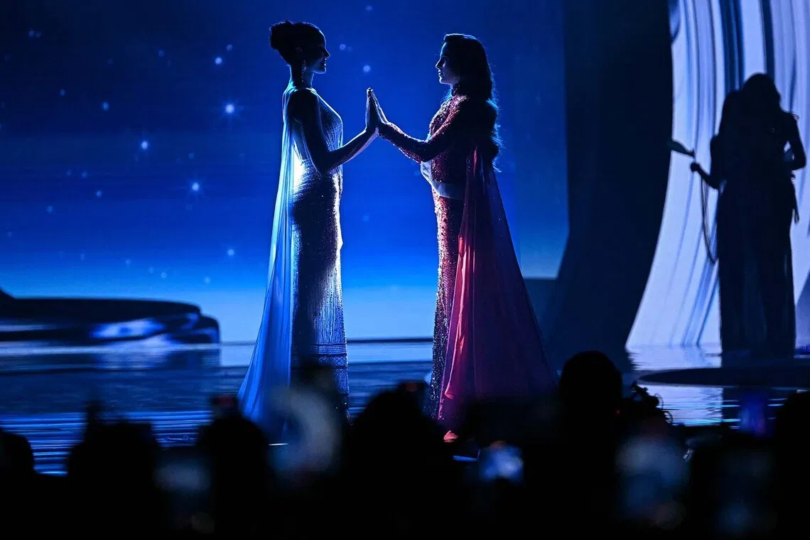 Miss Mexico Fatima Bosch (R) faces off with Miss Thailand Praveenar Singh (L) as they wait to hear the winner of the 2025 Miss Universe pageant in Nonthaburi, north of Bangkok, on November 21, 2025. (Photo by Lillian SUWANRUMPHA / AFP)