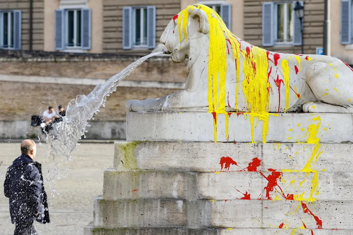 epa11118074 The stained Fountain of the Four Lions after two activists smeared paint on it, in Rome, Italy 01 February 2024. Two animal rights activists threw red, orange and yellow paint on the iconic fountain in Rome’s central Piazza del Popolo, as part of a campaign to end the use of animals in circuses.  EPA-EFE/Fabio Frustaci