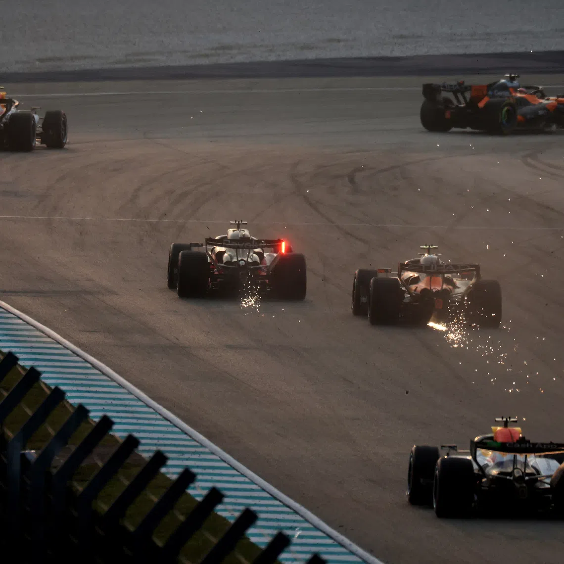 Formula One F1 - Bahrain Grand Prix - Sepang International Circuit, Sepang, Malaysia - October 4, 2026 RB's Arvid Lindblad, McLaren's Lando Norris, Audi's Nico Hulkenberg, McLaren's Oscar Piastri, RB's Liam Lawson and Aston Martin's Fernando Alonso in action during the race REUTERS/Hasnoor Hussain