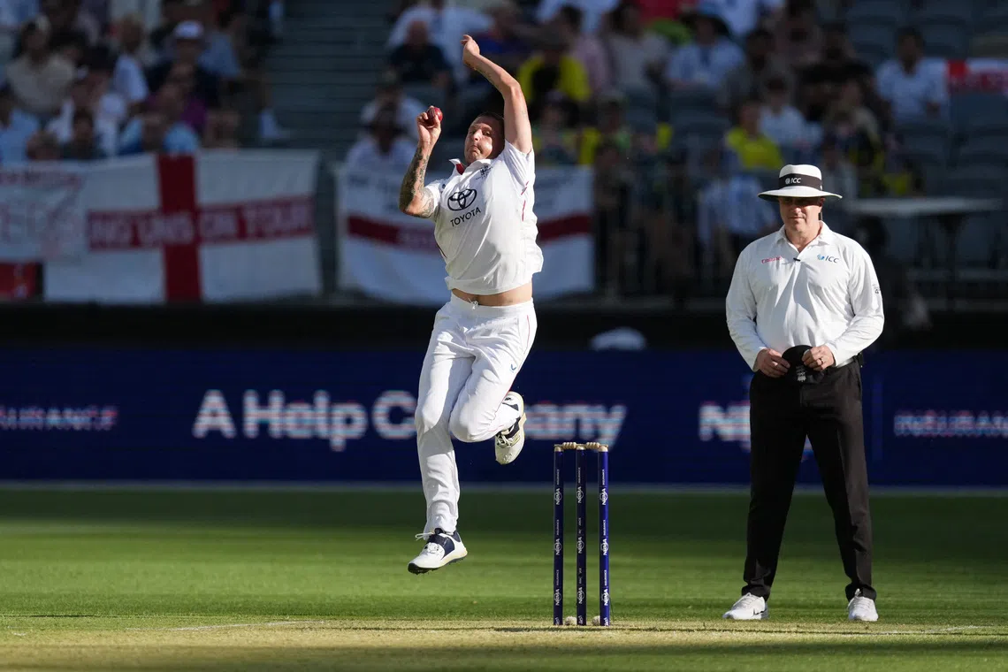 Cricket - The Ashes - Australia v England - First Test - Perth Stadium, Perth, Australia - November 21, 2025  England's Brydon Carse in action REUTERS/Asanka Brendon Ratnayake