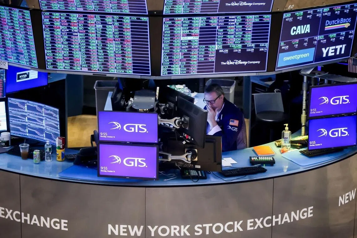 A trader works on the floor of the New York Stock Exchange in New York, USA.