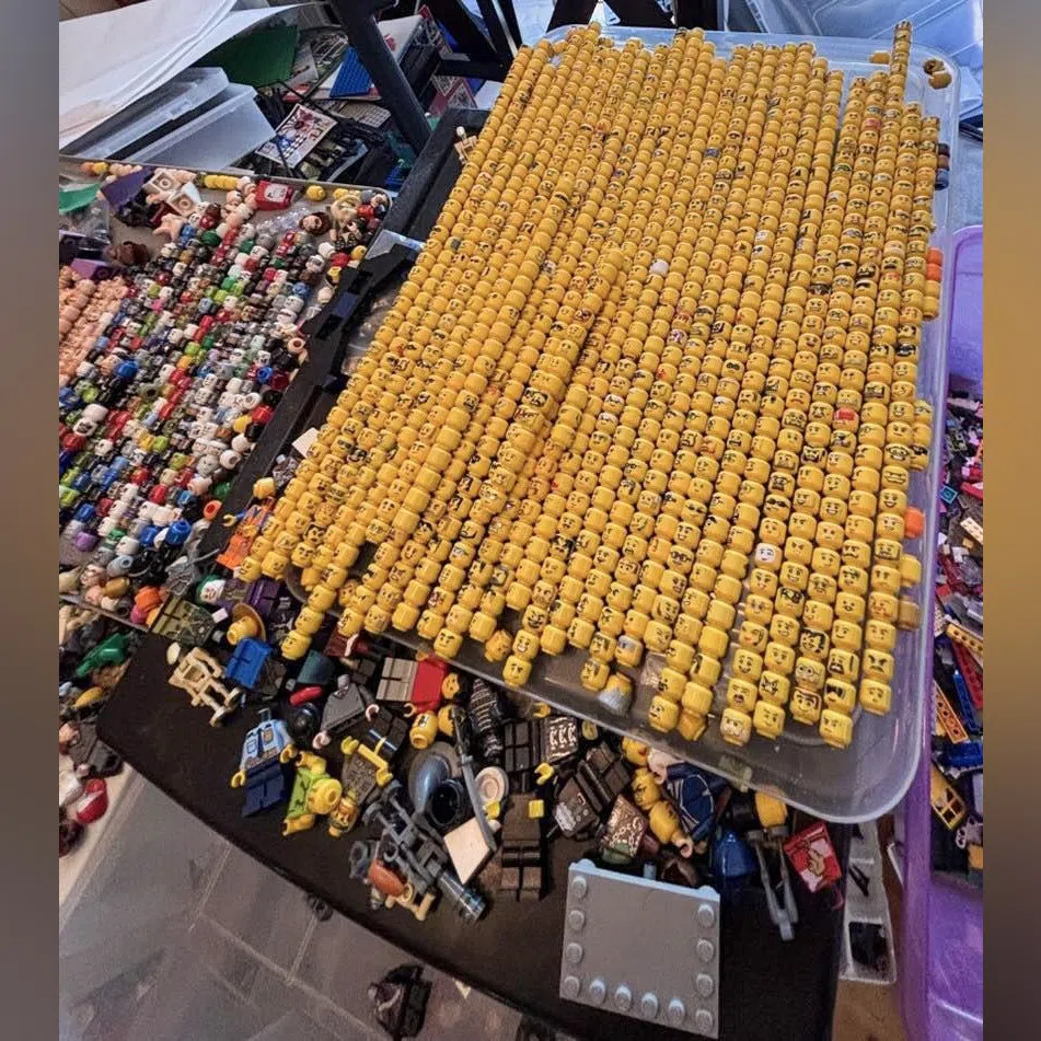 A tray of Lego mini-figurine heads, some of the tens of thousands of pieces and sets police found at a home in California.