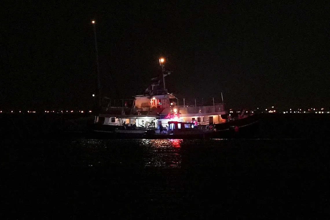 A Global Sumud flotilla vessel floats in the waters as Tunisian Maritime National Guard boats conduct an inspection in Sidi Bou Said, Tunisia, September 9, 2025. REUTERS/Jihed Abidellaoui