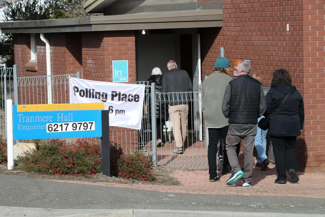 Voters entering a polling place at Tranmere Hall in Howrah, Australia, on July 19. 