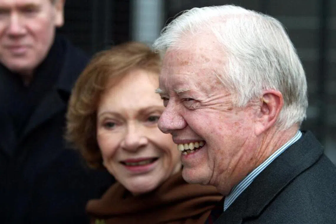 (FILES) Nobel laureate and former US President Jimmy Carter and his wife Rosalyn arrive 08 December 2002 in Oslo, where Carter will receive the Nobel Peace Prize 10 December. Jimmy Carter holds a unique place in US politics: he is the oldest former president and a Nobel peace laureate, who left office under a cloud of unpopularity and has seen his star rise ever since. (Photo by AFP stringer / SCANPIX / AFP)