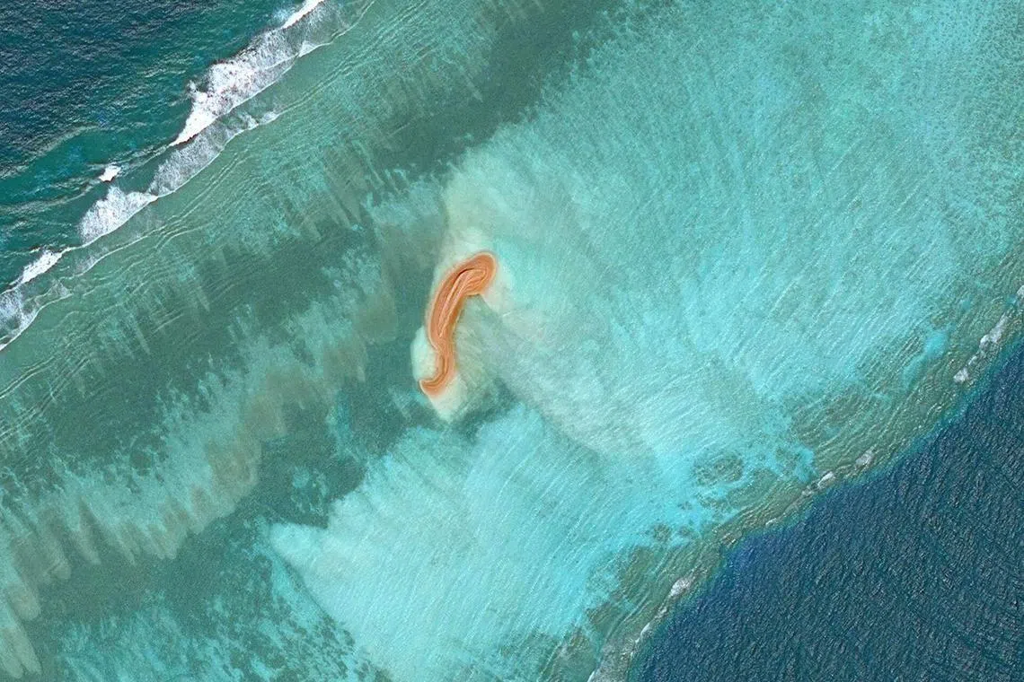 This handout satellite image taken on November 4, 2022 by Maxar Technologies shows a land formation at Eldad Reef in the Spratly Islands, in the disputed South China Sea.