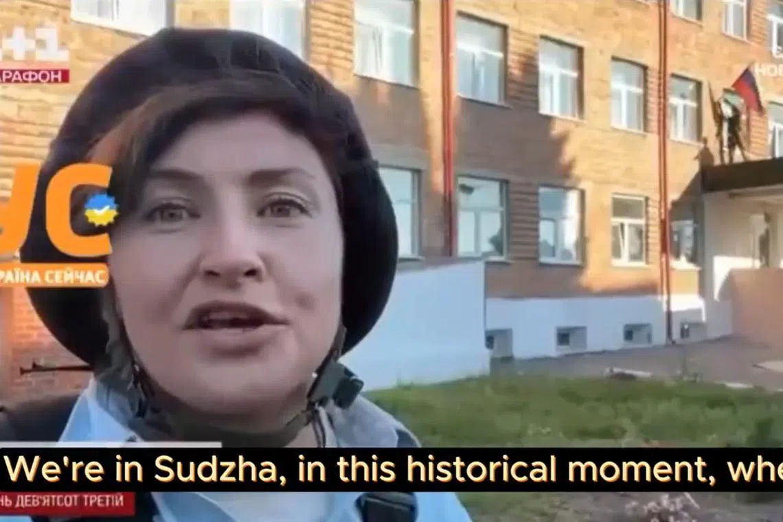 A video that state TV said was taken on Aug 14 shows three Ukrainian soldiers taking and pulling down a Russian flag shouting "Glory to Ukraine". 