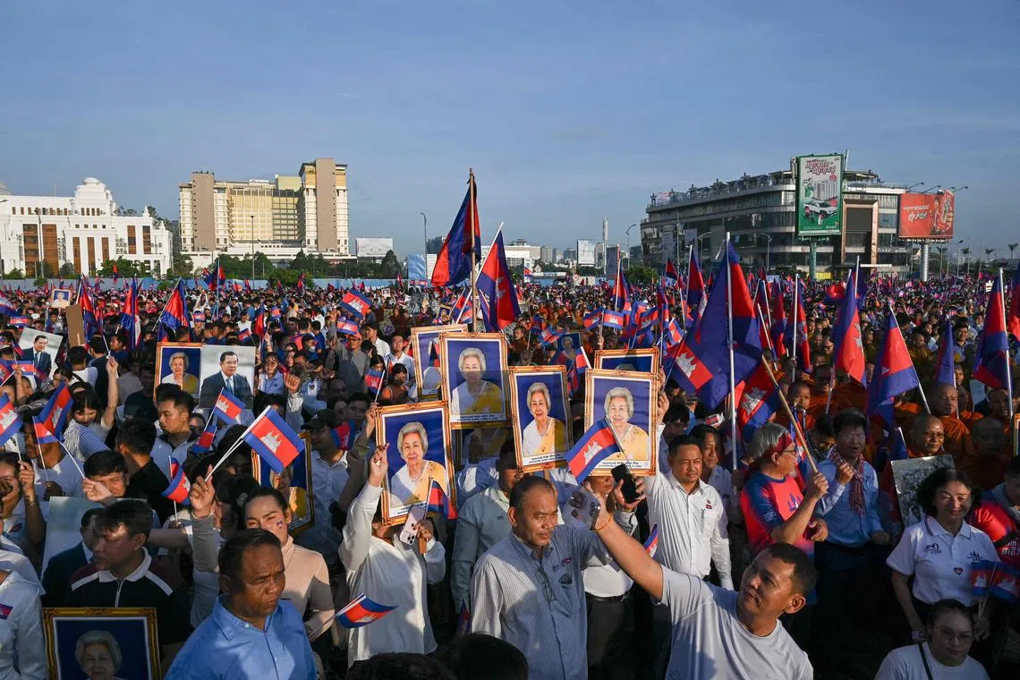 People take part in a solidarity march organised in support of the Cambodian government's actions in its recent border dispute with Thailand, in Phnom Penh on June 18, 2025. 
