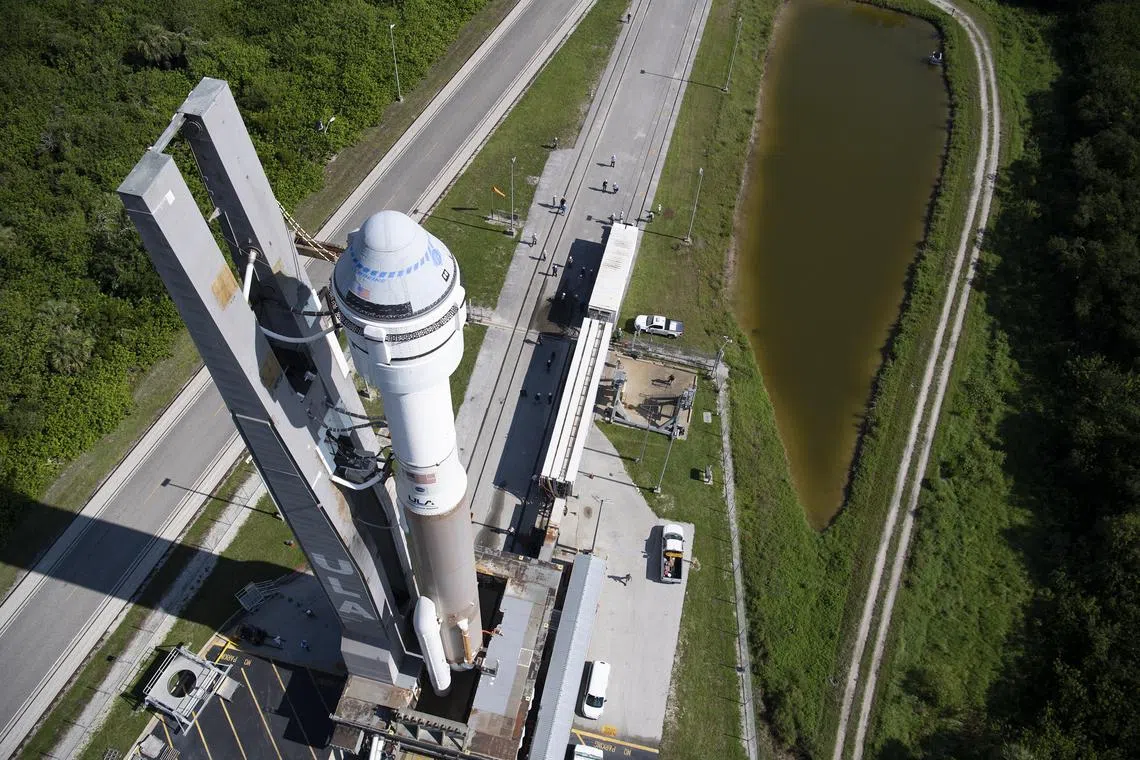 In a photo provided by NASA shows, a Starliner spacecraft sitting atop an Atlas V rocket, as they were wheeled to the launchpad at Cape Canaveral in Florida for a test flight in 2021. BoeingÕs Starliner capsule has had a long, difficult road to human spaceflight. (NASA via The New York Times) NO SALES; FOR EDITORIAL USE ONLY 