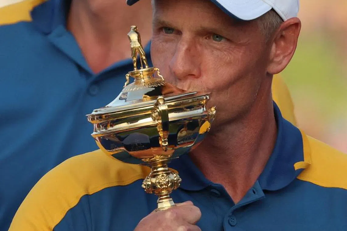 Golf - The 2023 Ryder Cup - Marco Simone Golf & Country Club, Rome, Italy - October 1, 2023 Team Europe captain Luke Donald kisses the trophy as he celebrates after winning the Ryder Cup REUTERS/Phil Noble/ File photo