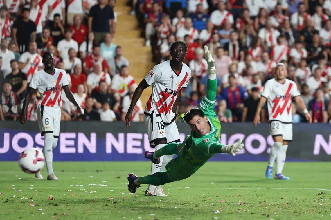 Soccer Football - LaLiga - Rayo Vallecano v FC Barcelona - Campo de Futbol de Vallecas, Madrid, Spain - August 27, 2024 FC Barcelona's Dani Olmo scores their third goal past Rayo Vallecano's Dani Cardenas REUTERS/Violeta Santos Moura