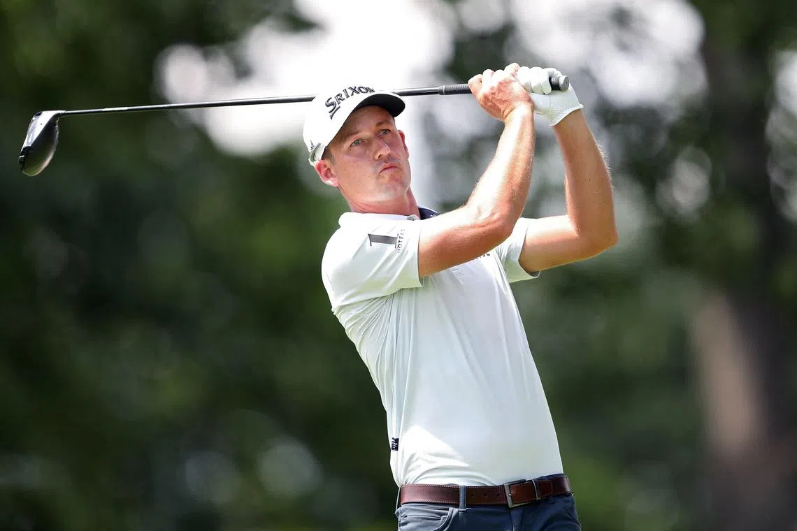 Andrew Putnam of the United States plays his shot from the 12th tee during the second round of the Rocket Classic.