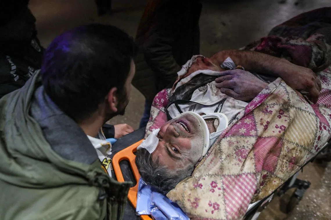 An injured man arrives to a hospital after an earthquake in Iskenderun district of Hatay, Turkey,  Feb 6, 2023. 