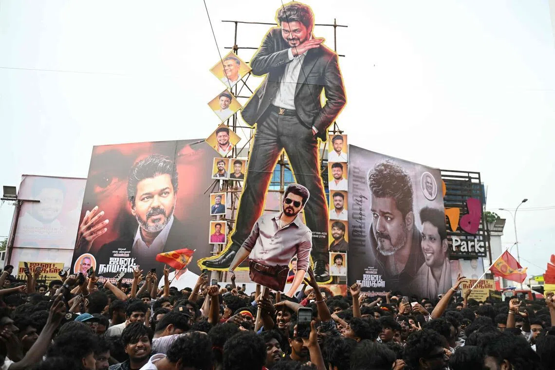 Fans celebrate during the theatrical release of film 'Jana Nayagan' starring actor and Tamil Nadu's Chief Minister C. Joseph Vijay, in Chennai on July 23, 2026. (Photo by R.Satish BABU / AFP)