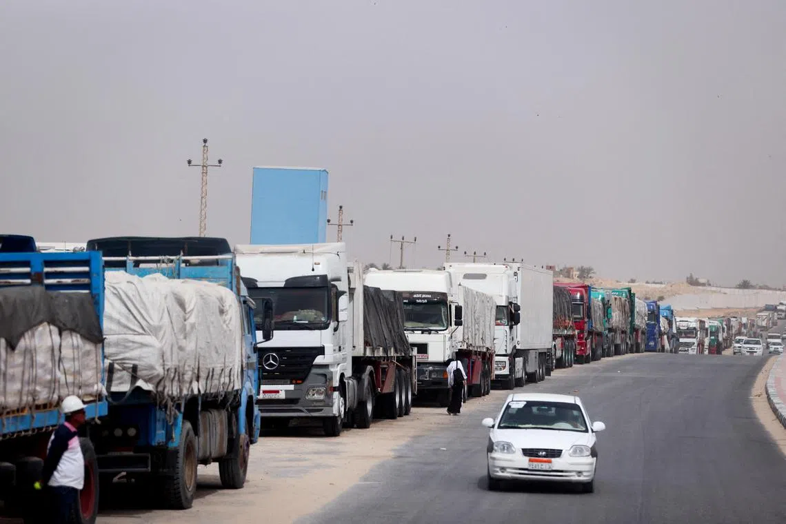 In this April 25 photo, trucks stand at the Rafah border crossing between Egypt and the Gaza Strip. Israel seized the crossing on the Gaza side in May during its offensive in the city of Rafah. 
