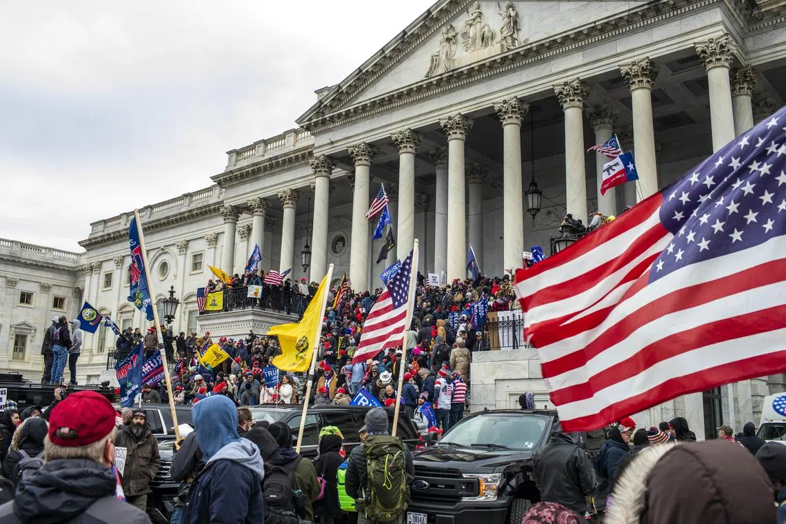 Supporters of then-President Donald Trump storm the Capitol in Washington on Jan 6, 2021. 