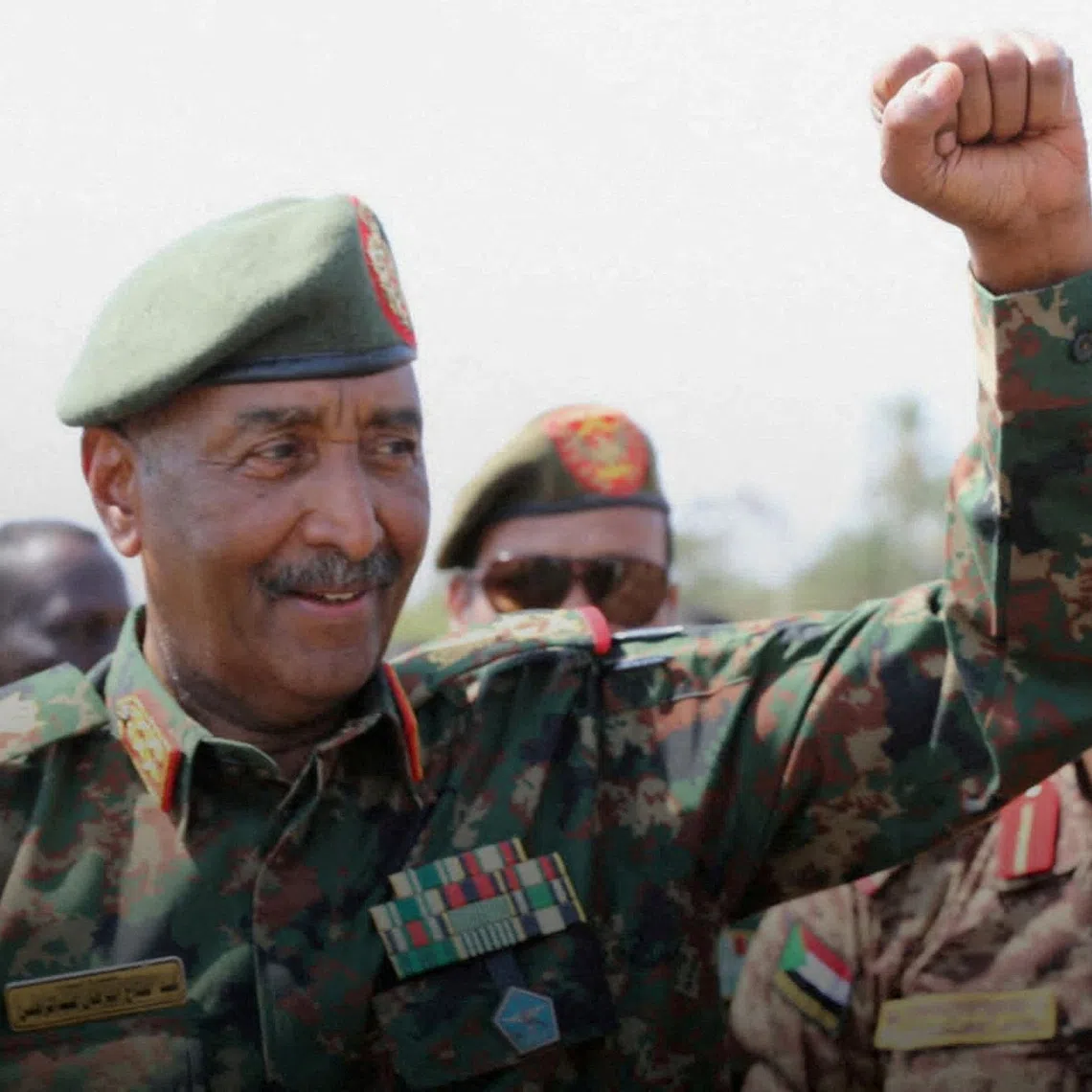 FILE PHOTO: Sudan's army chief Abdel Fattah al-Burhan gestures to soldiers inside the presidential palace after the Sudanese army said it had taken control of the building, in the capital Khartoum, Sudan March 26, 2025. Sudan Transitional Sovereignty Council/Handout via REUTERS/File Photo