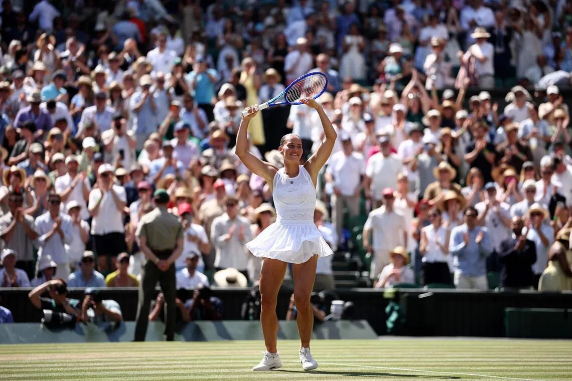 Ukraine’s Marta Kostyuk celebrates after beating Italy’s Jasmine Paolini in the Wimbledon quarter-finals on July 8.