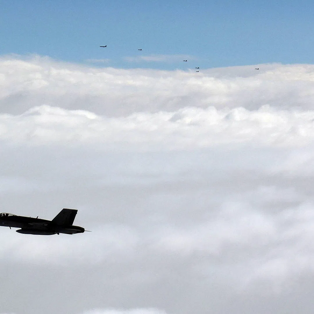 Finnish F/A-18 Hornet and Russian military aircraft fly over the Gulf of Finland, September 24, 2026. Swedish Air Force/Finnish Air Force/Handout via REUTERS