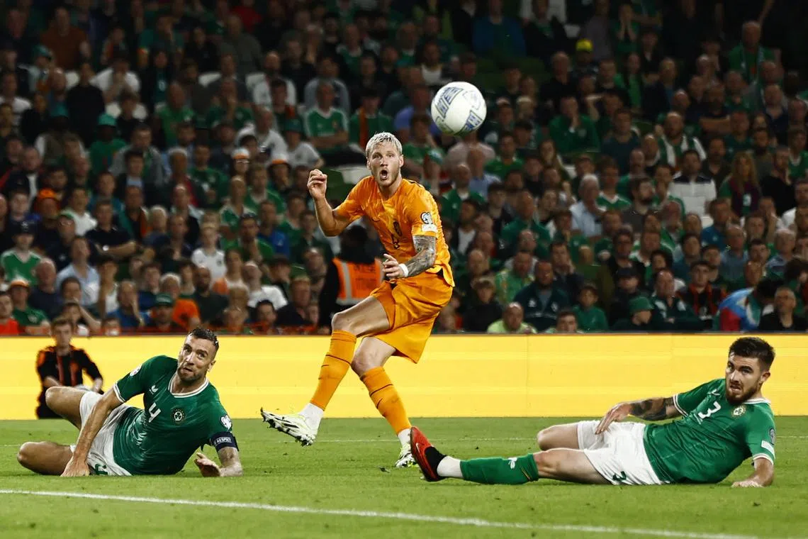 Netherlands' Wout Weghorst in action with Republic of Ireland's Shane Duffy and Ryan Manning.