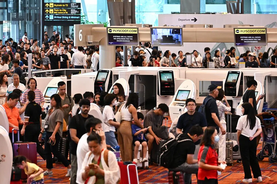 Passengers queueing at the Scoot check-in counters at  Changi Airport Terminal 1 due to the IT outage on July 19, 2024. Changi Airport Group (CAG) stated that due to a global outage affecting the IT systems of many organizations, the check-in process for some airlines at Changi Airport is being managed manually.

