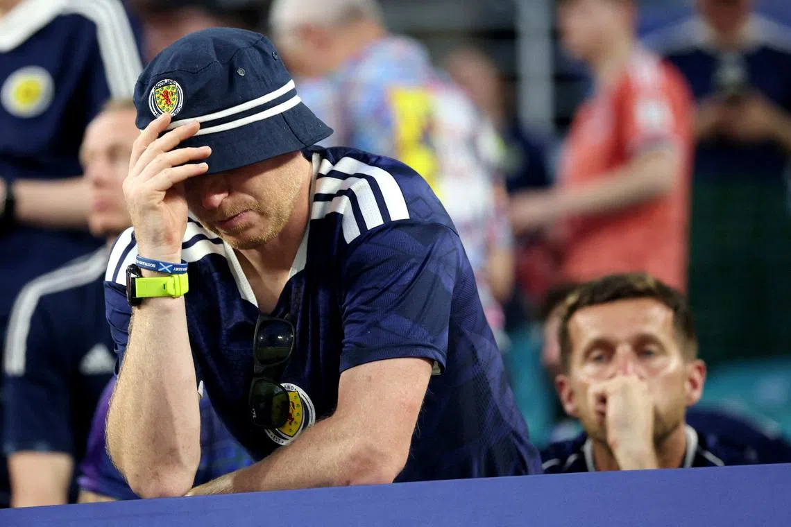 Soccer Football - FIFA World Cup 2026 - Group C - Scotland v Brazil - Miami Stadium, Miami Gardens, Florida, U.S. - June 24, 2026 Scotland fans look dejected at the end of the match REUTERS/Paul Childs