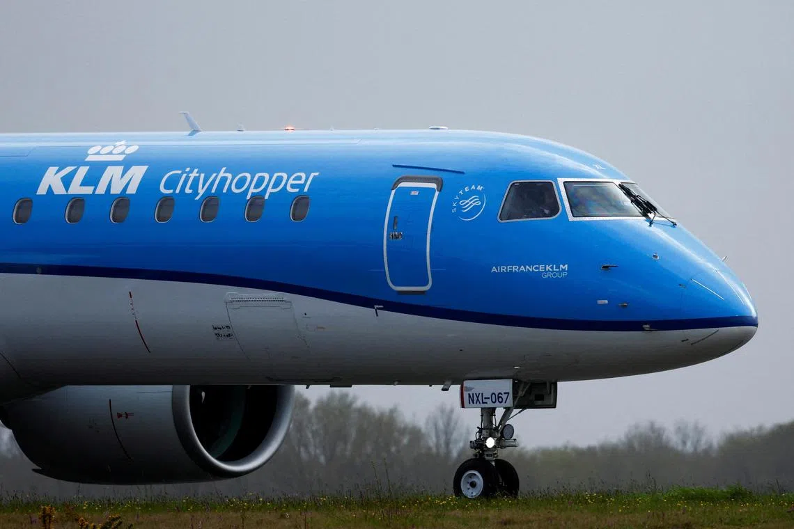 FILE PHOTO: A KLM Embraer E195-E2 Aircraft prepares to take off from the Nantes Atlantique Airport in Bouguenais, near Nantes, France, April 3, 2024. REUTERS/Stephane Mahe/File Photo