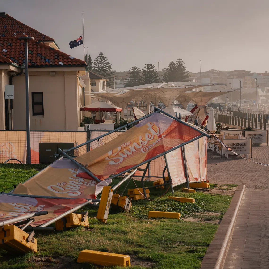 An Australian national flag flying at half-mast at the Bondi Pavilion, the site of the deadly shooting, on Dec 15.