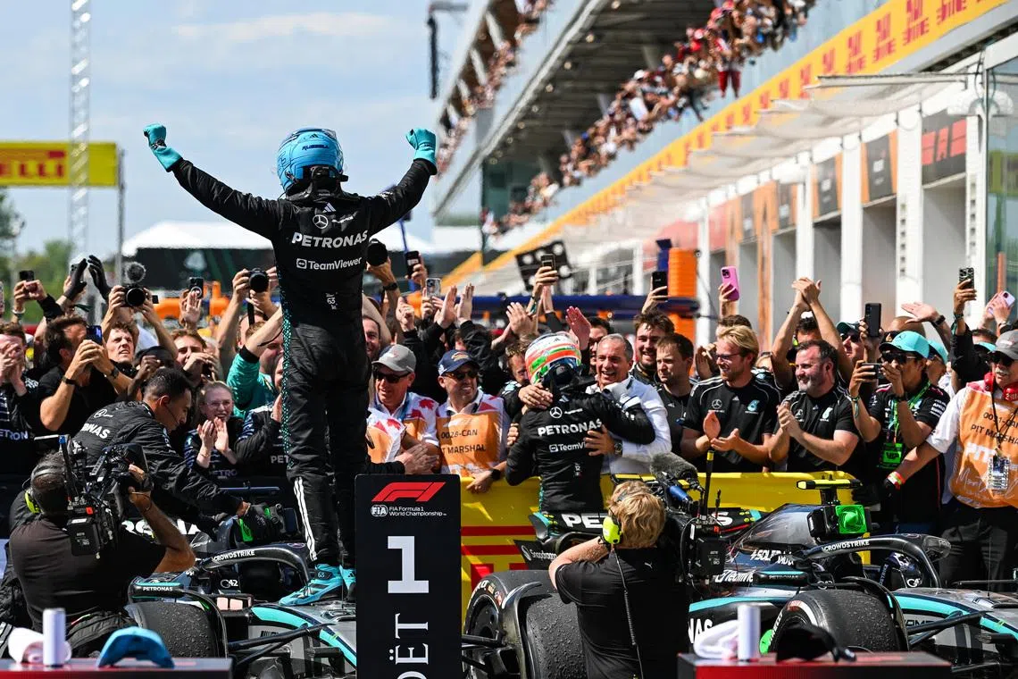 Jun 15, 2025; Montreal, Quebec, Canada; Winner of the F1 Canadian Grand Prix Mercedes driver George Russell (63) reacts at Circuit Gilles-Villeneuve. Mandatory Credit: David Kirouac-Imagn Images