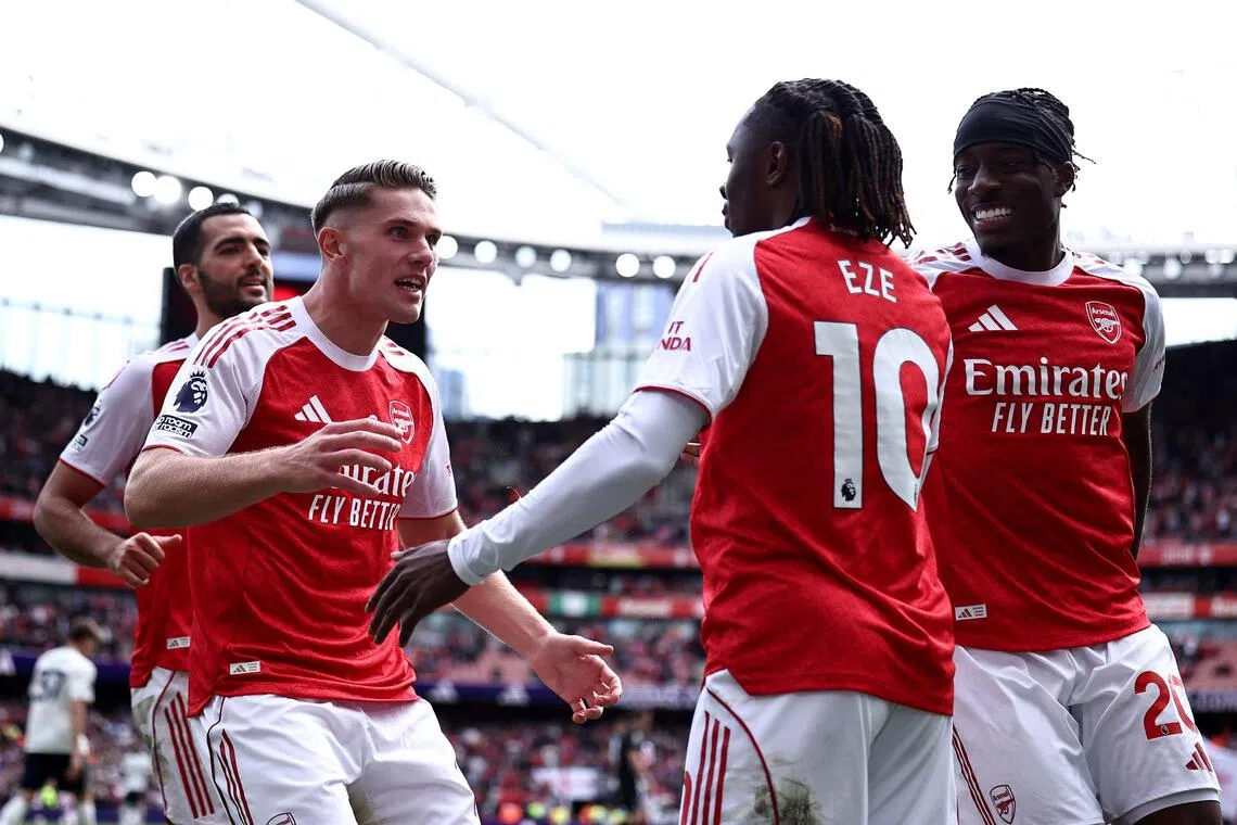 Arsenal striker Viktor Gyokeres celebrates scoring the team's second goal with midfielder Eberechi Eze during the 3-0 English Premier League win over Nottingham Forest at the Emirates Stadium in London on Sept 13, 2025, as Mikel Merino (far left) and Noni Madueke look on.