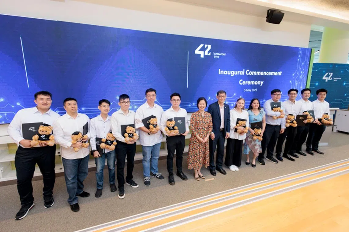 Ms Gan Siow Huang, Minister of State for Foreign Affairs, and Trade and Industry, with the graduands from the pioneering batch of 42 Singapore.