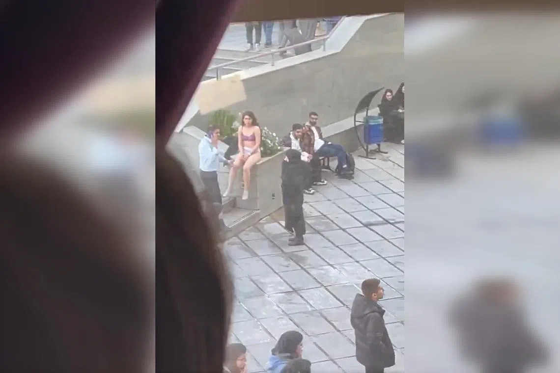 A video posted on social media showed security guards at a branch of the Islamic Azad University detaining the unidentified woman.