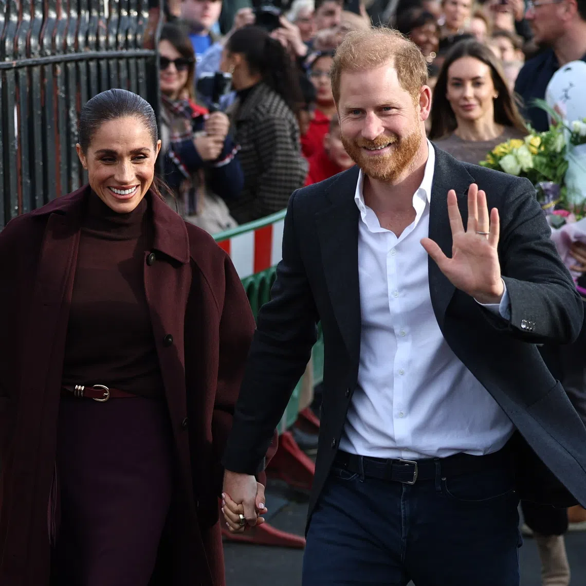 Prince Harry and his wife Meghan arriving at the Community Recording Studio in Nottingham, Britain, on Oct 15.