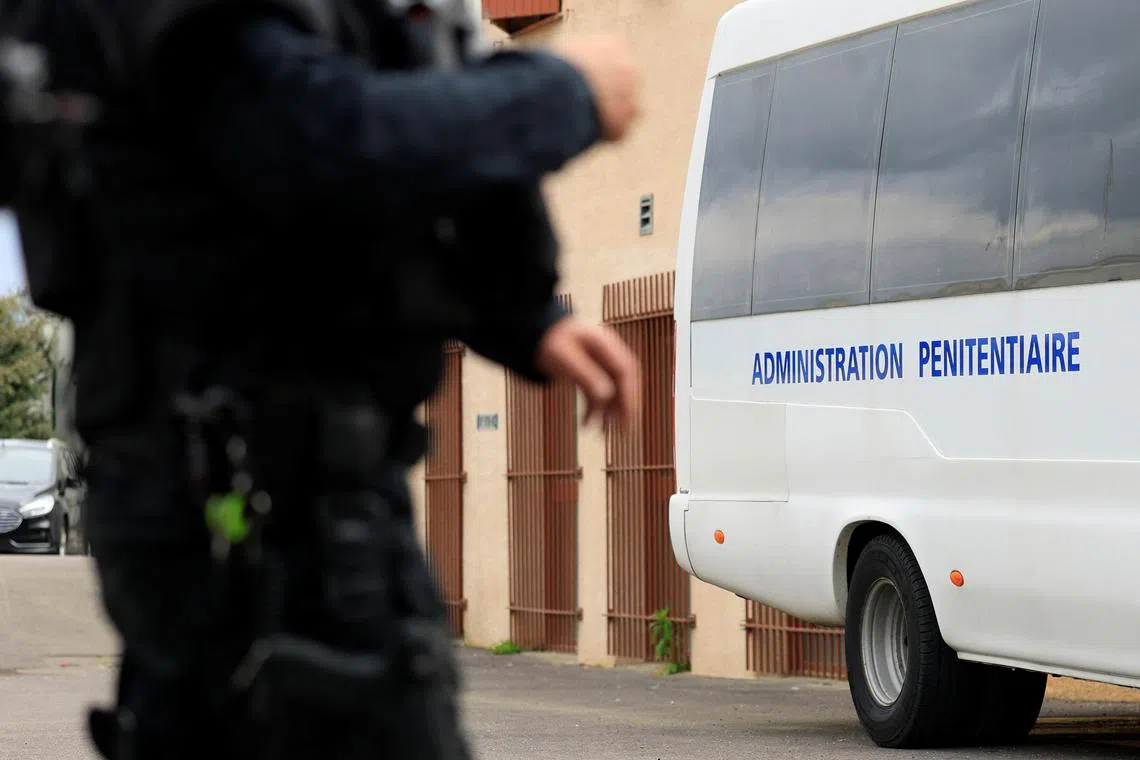 FILE PHOTO: A member of the regional intervention and security team (ERIS13) stands in front of the Aix-Luynes Penitentiary Center in Aix-en-Provence, France, April 15, 2025.  REUTERS/Manon Cruz/File Photo