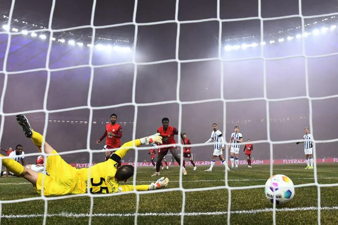 Soccer Football - DFB Cup - Quarter-Finals - Hertha BSC v Kaiserslautern - Olympiastadion, Berlin, Germany - January 31, 2024 Kaiserslautern's Jan Elvedi scores their first goal REUTERS/Annegret Hilse