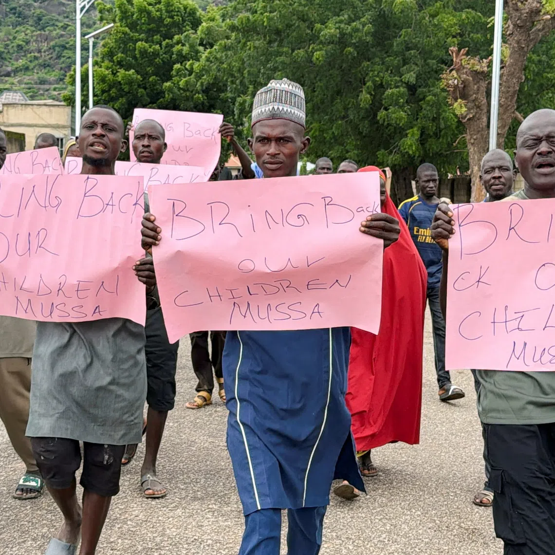 Parents of abducted students hold placards during a protest calling for the release of their children, as students remain in the custody of their captors in Askira-Uba, Borno State, Nigeria, August 20, 2026. Picture taken with a mobile phone. REUTERS/Umaru Kirawa