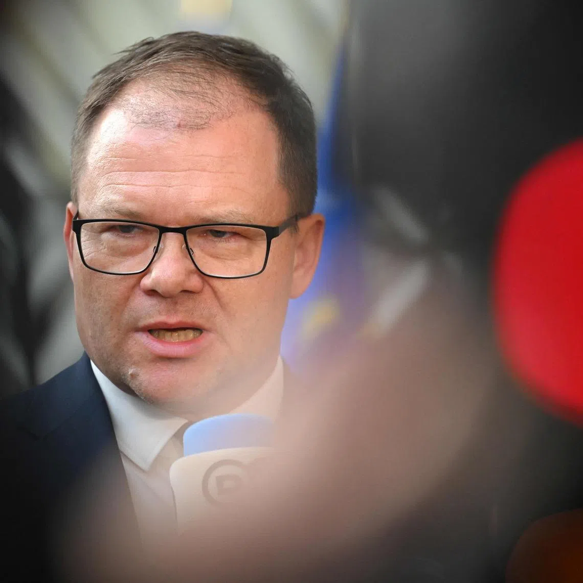 German Environment Minister Carsten Schneider, who was in the audience, walked out following the remarks.