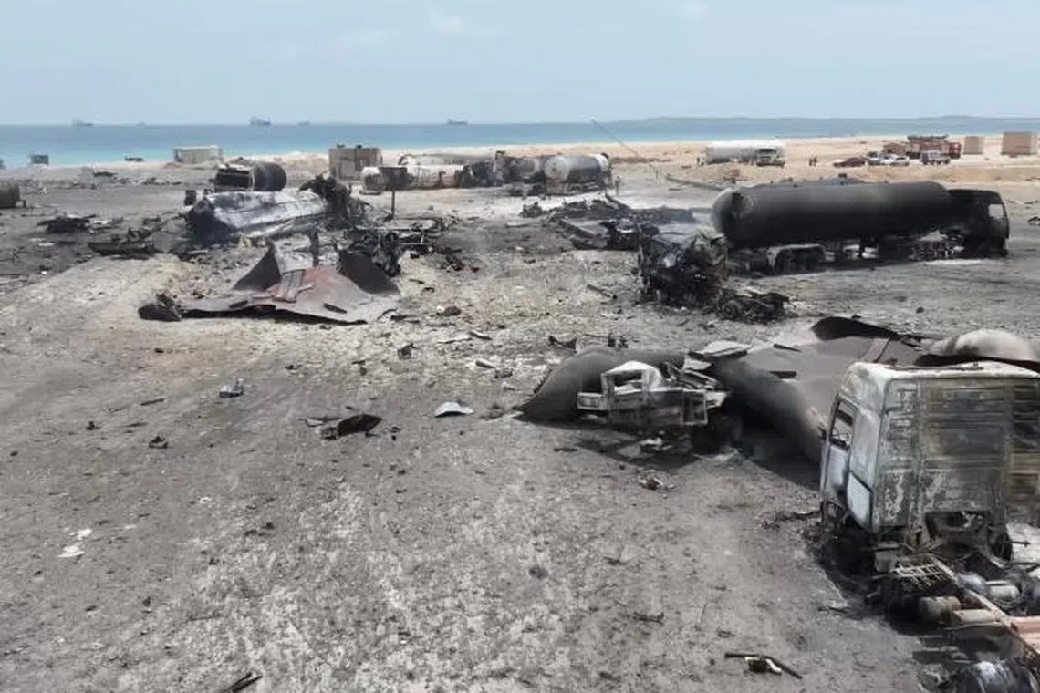 A drone view shows charred vehicles standing in the aftermath of what Al Masirah TV said was a U.S. strike on the Ras Isa fuel port, Al Jazirah, Yemen, in this screengrab from a handout video released on April 18, 2025. Al-Masirah TV/Handout via REUTERS THIS IMAGE HAS BEEN SUPPLIED BY A THIRD PARTY.