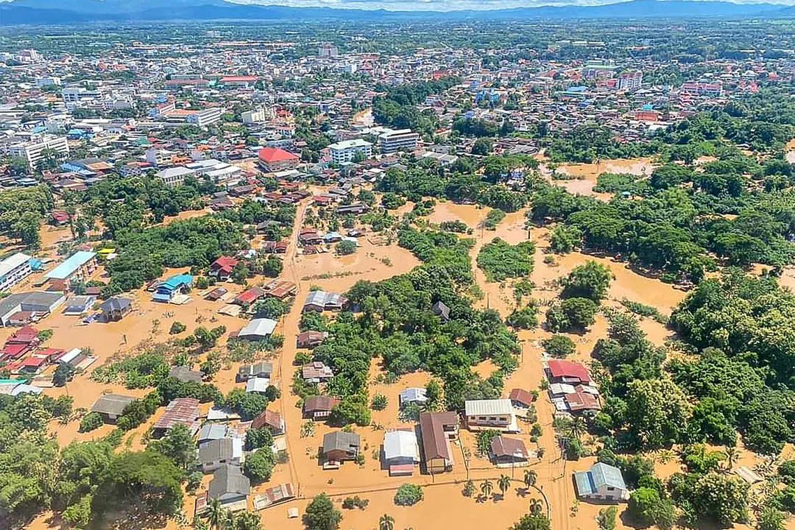 Partially submerged houses in the aftermath of floods in Phrae Province, northern Thailand on Aug 24. 
