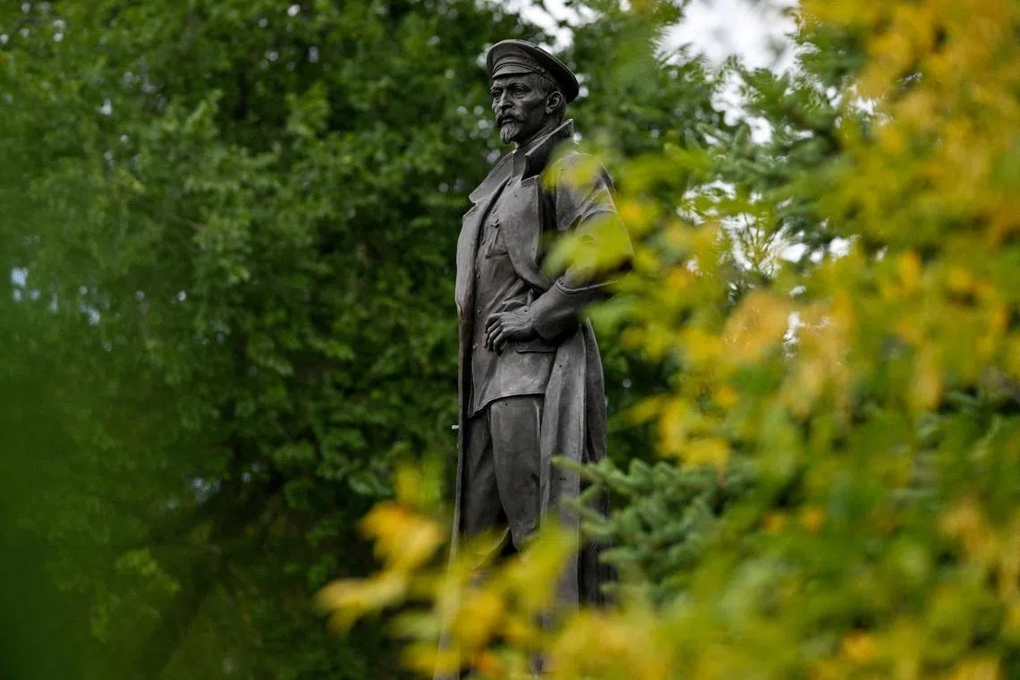 FILE PHOTO: A new statue of Felix Dzerzhinsky nicknamed \"Iron Felix\", a Soviet revolutionary who founded the Soviet secret police following the 1917 Bolshevik Revolution, rises above a public garden the day after an unveiling ceremony marking Dzerzhinsky's birthday anniversary in Omsk, Russia, September 12, 2025. REUTERS/Alexey Malgavko/File Photo