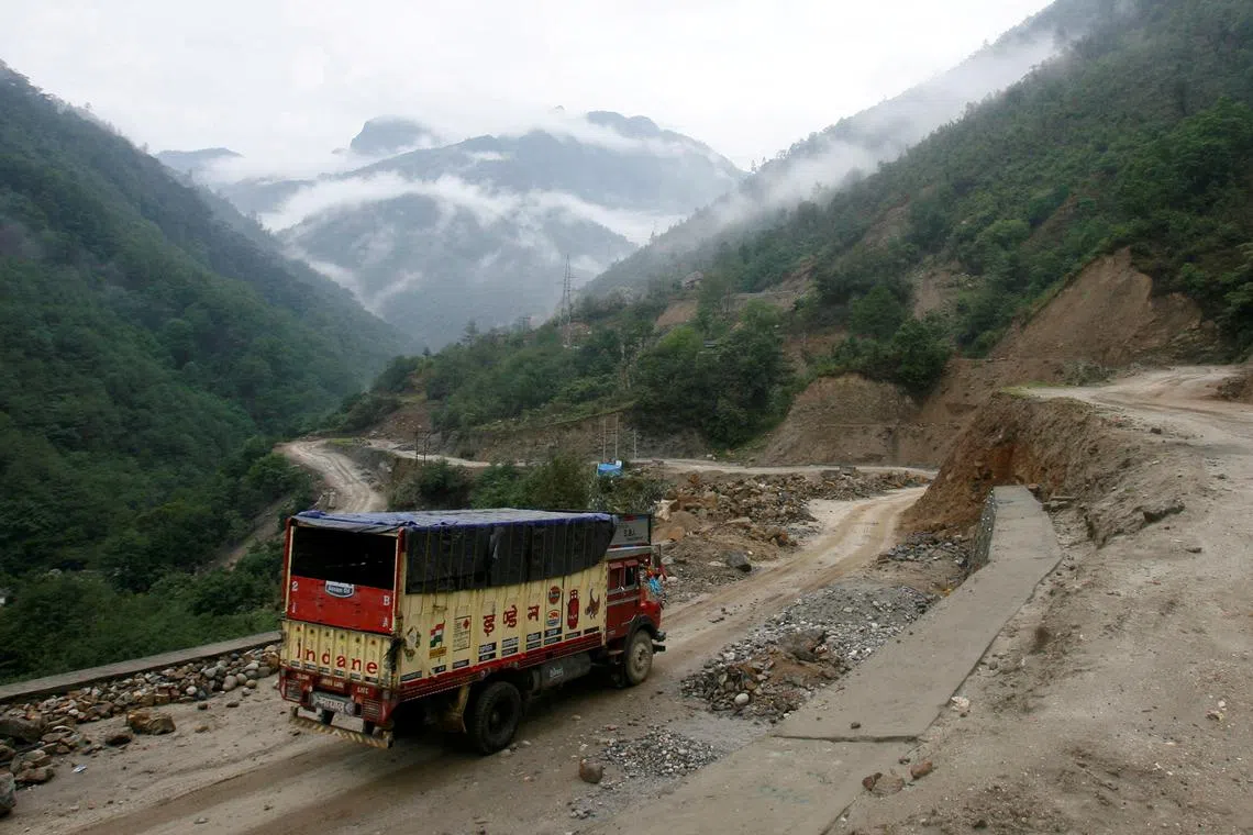 A delivery truck drives along India's Tezpur-Tawang highway which runs to the Chinese border, in the northeastern Indian state of Arunachal Pradesh on May 12, 2012.