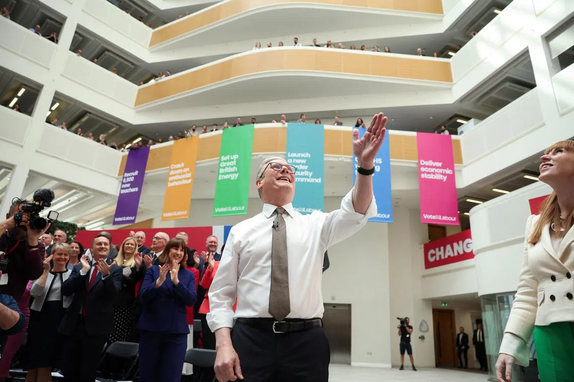 British opposition Labour Party leader Keir Starmer gestures next to deputy leader Angela Rayner at the launch of the Labour Party's manifesto, in Manchester, Britain, June 13, 2024. REUTERS/Phil Noble