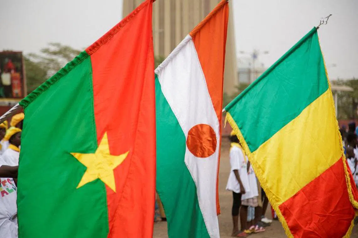 FILE PHOTO: Flags of Burkina Faso, Niger and Mali are seen during a demonstration that was called by Mali's Junta to support their decision to leave the Economic Community of West African States regional bloc ''ECOWAS'', in Bamako, Mali, February 1, 2024. REUTERS/Stringer/File Photo
