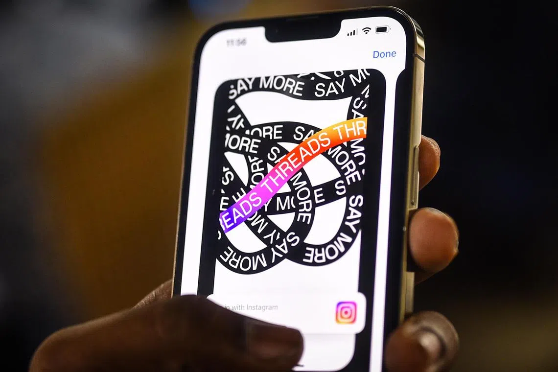 epa10732130 An employee downloads the newly unveiled Threads app on an iPhone at a design company in Chennai, India, 07 July 2023. Meta, the company behind Facebook and Instagram, said in a press release on 05 July 2023, that Mark Zuckerberg announced the initial version of 'Threads', an Instagram's text-based conversation app.  EPA-EFE/IDREES MOHAMMED