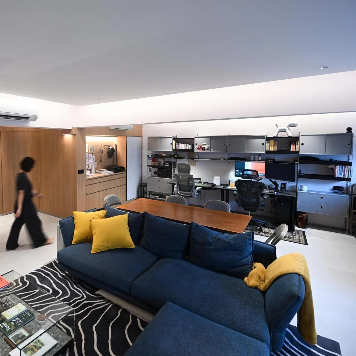 Married couple James Loh and Crystal Yeap demolished nearly all the walls in their flat. It increased their communal living area by nearly 60 per cent.