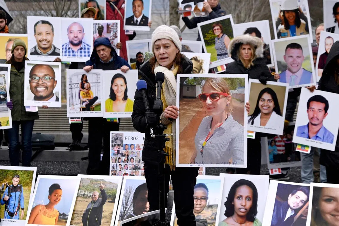 Ms Catherine Berthet whose daughter Camille Geoffroy died in the Boeing 737 MAX crash in Ethiopia on March 10, 2019, at a memorial protest in front of Boeing offices in Arlington, Virginia, on March 10, 2023 to mark the four-year anniversary of the event. 