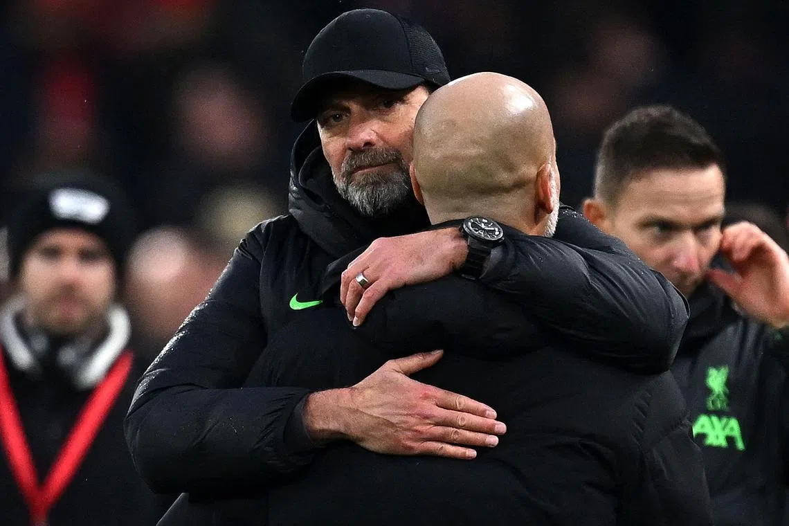 Liverpool manager Jurgen Klopp embracing Manchester City' boss Pep Guardiola at the end of the match.
