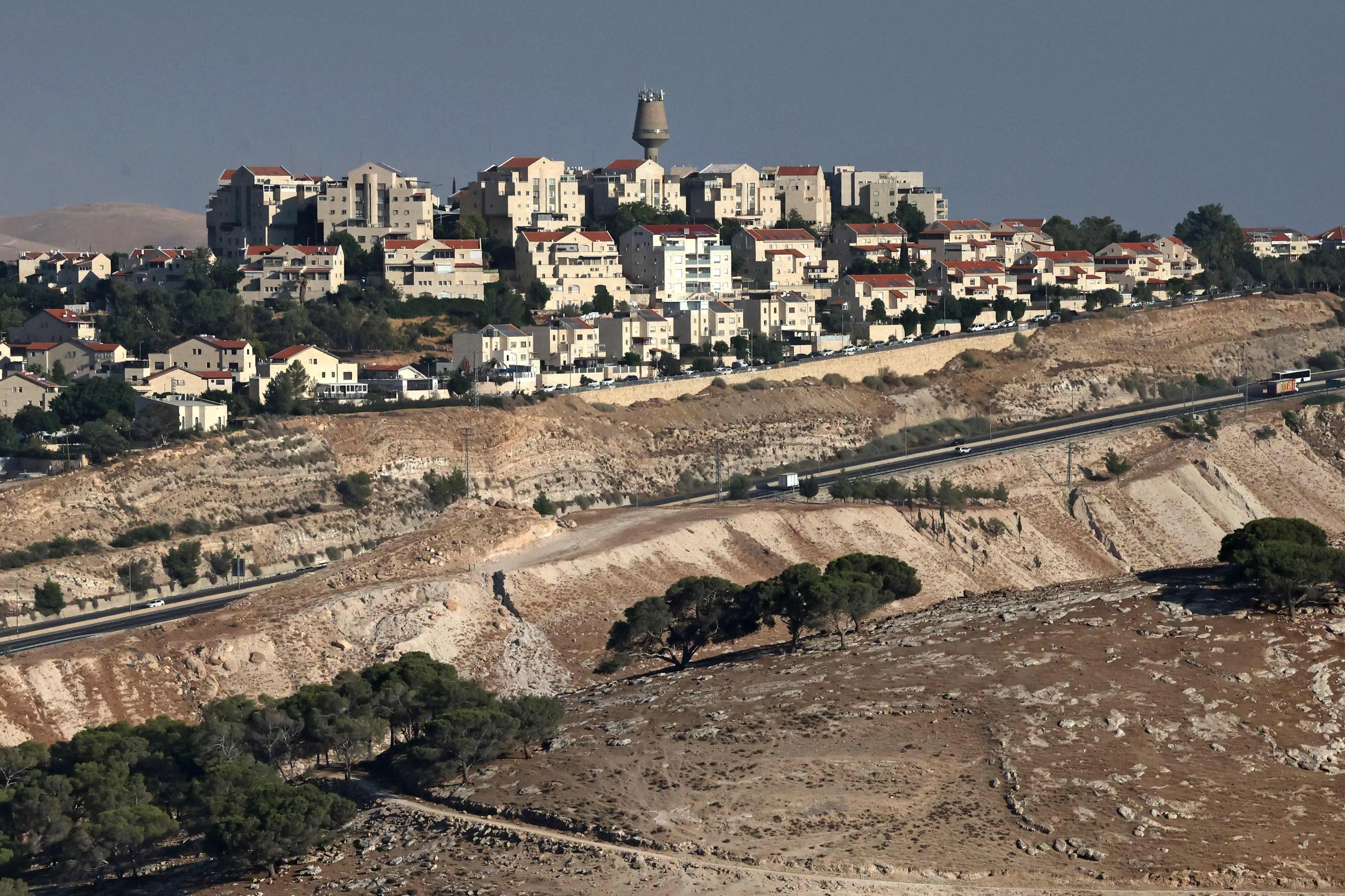 A photograph taken from the E1 corridor, an area in the occupied West Bank, shows vehicles driving along the highway near the Israeli settlement of Maale Adumim, on Sept 8.