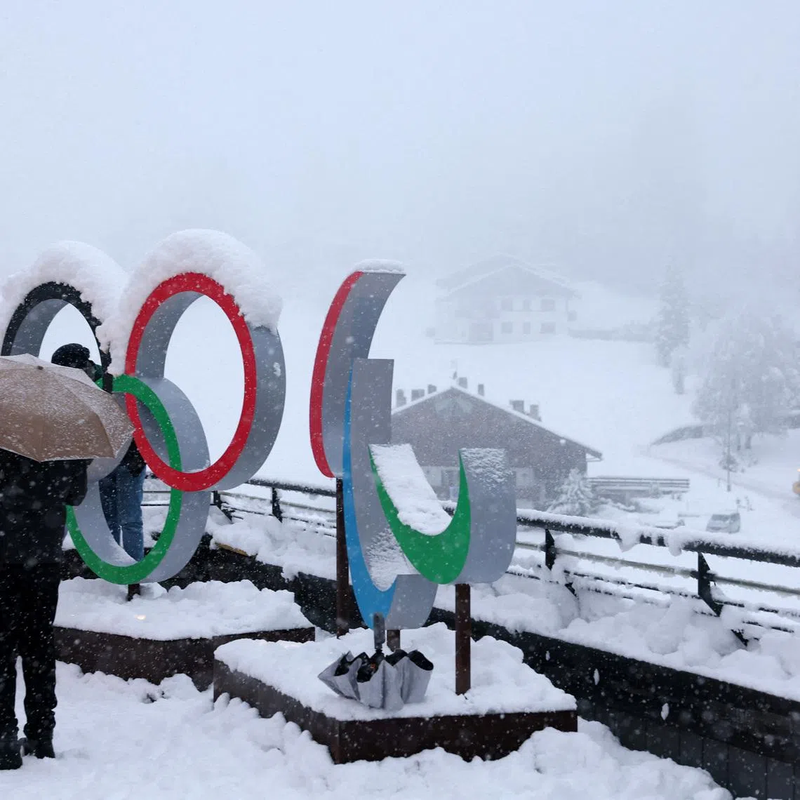 Milano Cortina 2026 Winter Olympics - Previews - Cortina d'Ampezzo, Italy - January 25, 2026 General view of the Olympic rings and the Paralympics Agitos logo covered in snow ahead of the Milano Cortina 2026 Winter Olympics REUTERS/Claudia Greco